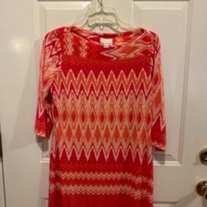 Orange patterned dress.